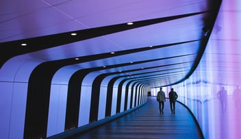 People walking in a tunnel