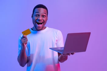 Man with a credit card and computer